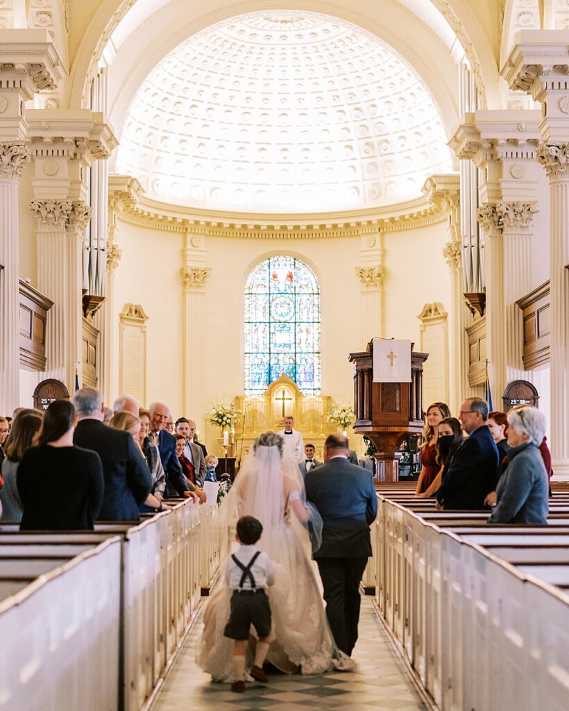 The groom sees his bride for the first time in St Philip's church
