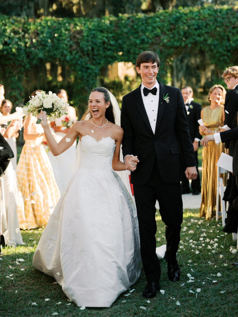 Bride and groom walk down the aisle 