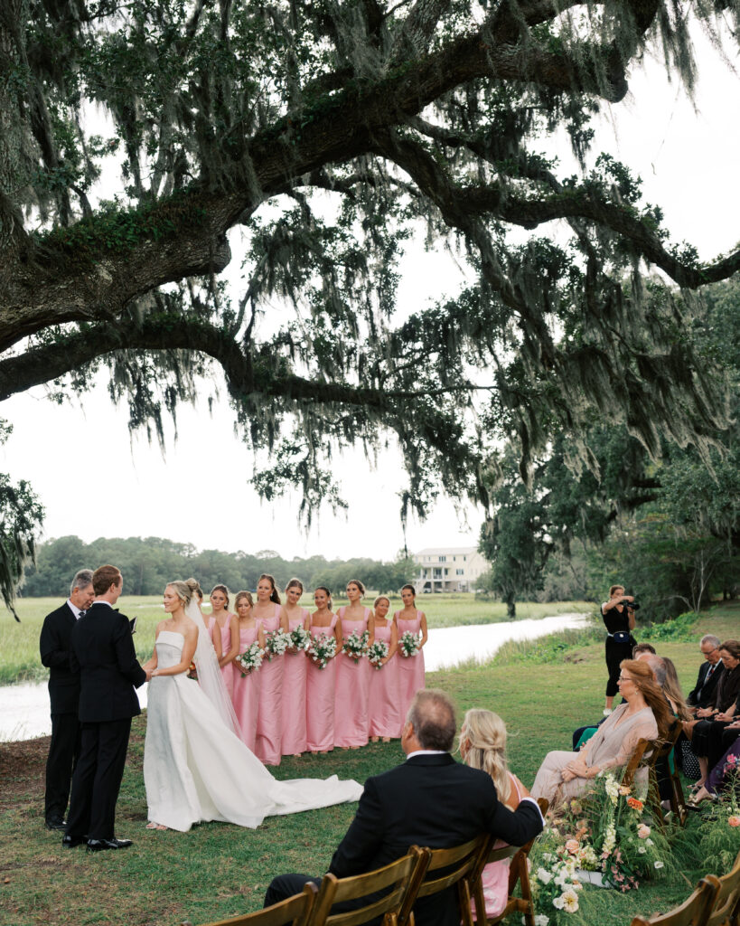 mom and dad watch their daughter get married