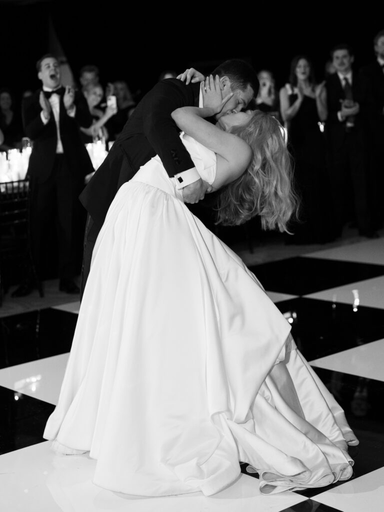Couple kissing on the dance floor at Houstonian Club wedding