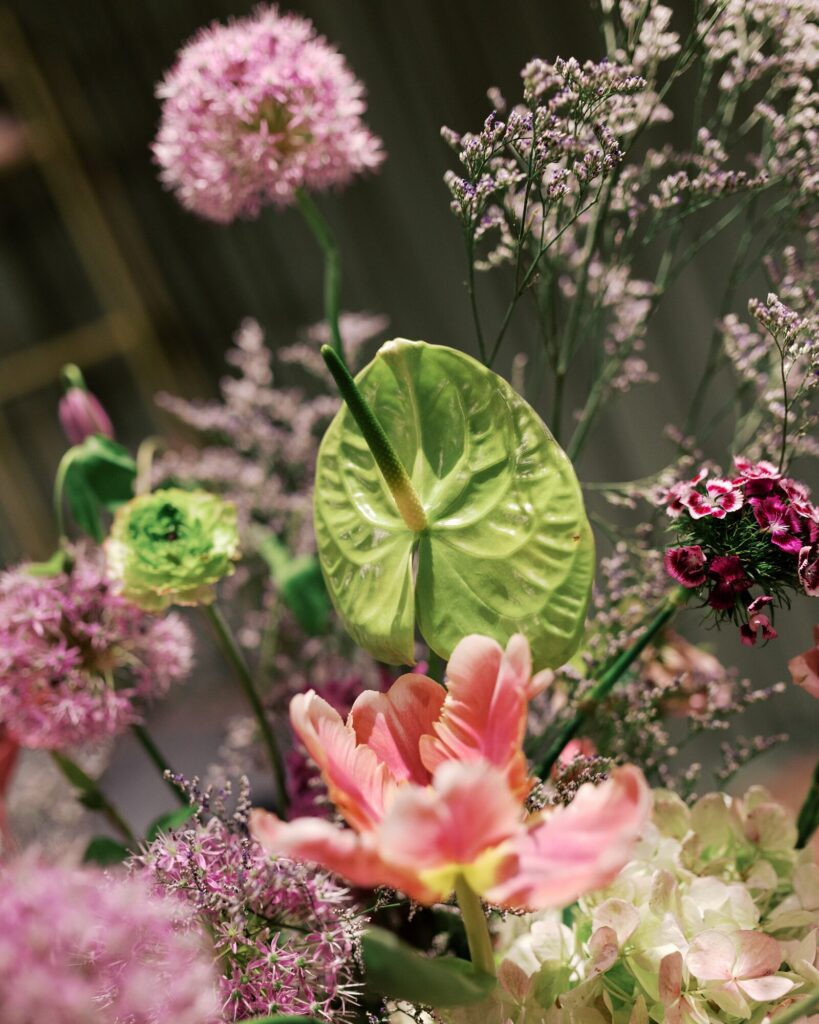 An arrangement of tropical flowers at a wedding. 