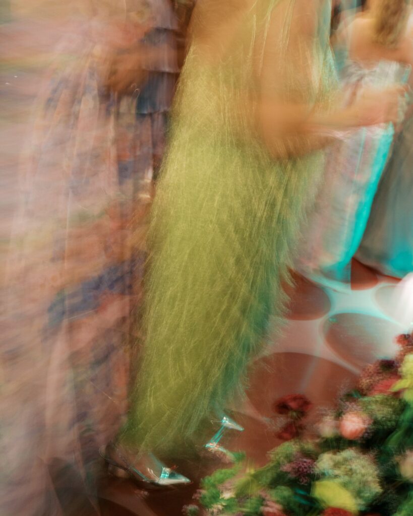 A long exposure photo of a guest dancing at a wedding at the Gibbes Museum. 